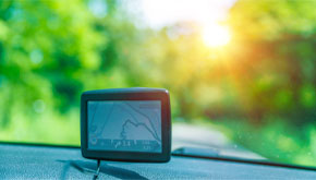 A GPS navigation device mounted to a car dashboard