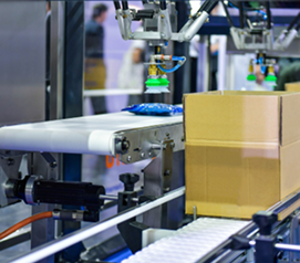 Automated conveyor system transporting a cardboard box