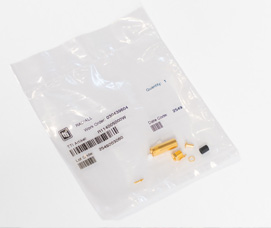 Clear plastic packaging bag containing small gold connectors, pins and components with product labels and barcodes