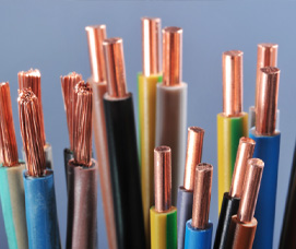 Bundle of multi-colored electrical cables with exposed copper conductors