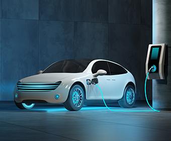 electric car hooked up to charger