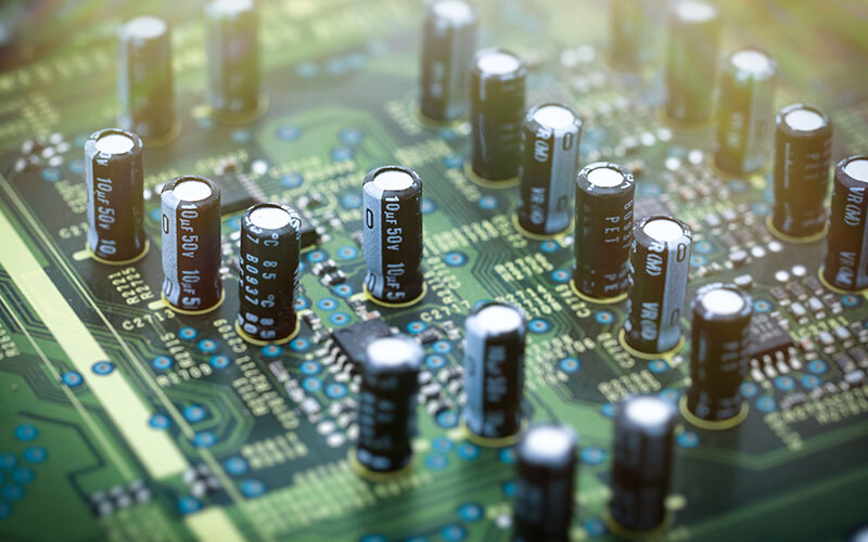 Close-up of a circuit board with electrolytic capacitors.